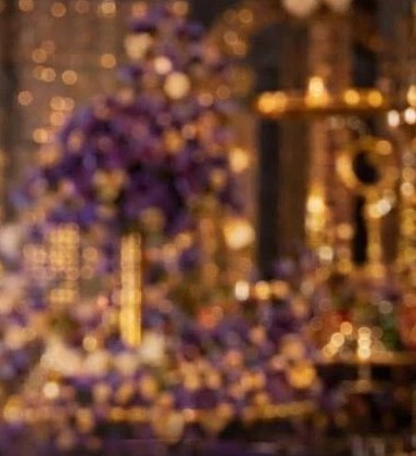 Purple and gold event decor inside the venue